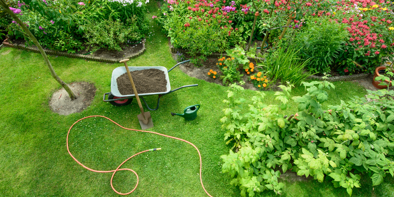 Aerial image of gardening tools on a lawn